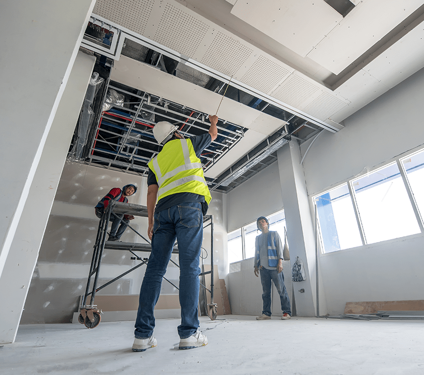 Workers Installing The Ceiling